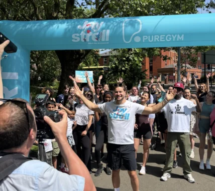 people cross the finish line at a PureGym race